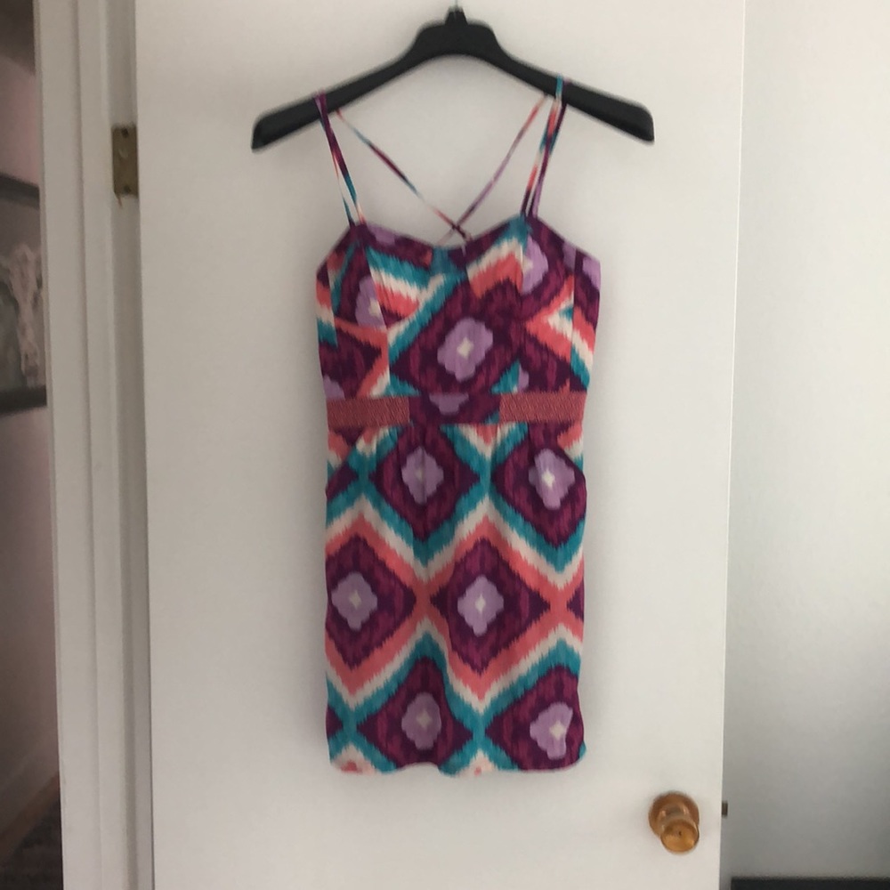 Adorable mini dress. Native pattern with spaghetti straps and front pockets!